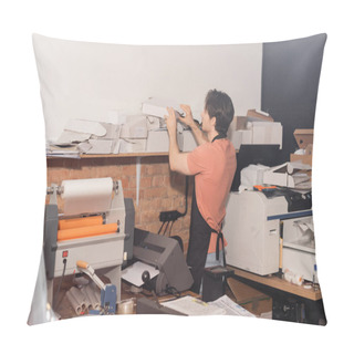 Personality  Young Typographer In Apron Reaching Folded Carton Boxes Next To Equipment In Print Center  Pillow Covers