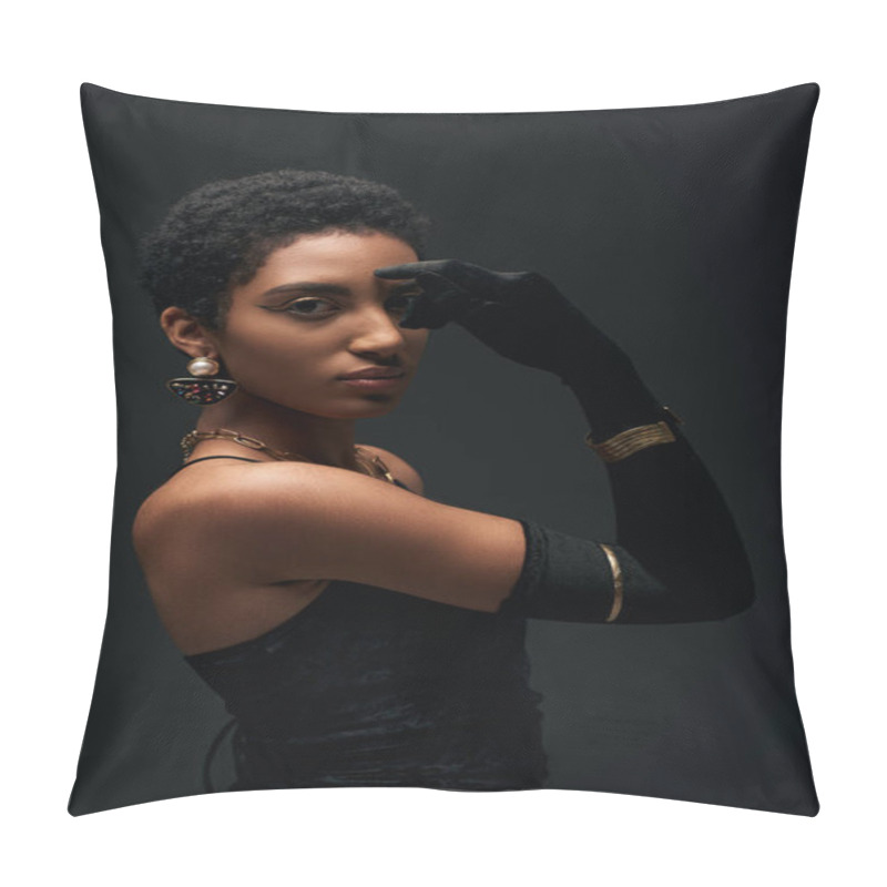 Personality  Fashionable and short haired african american model in dress, accessories and glove covering eye while posing isolated on black, high fashion and evening look pillow covers