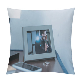 Personality  Selective Focus Of Photo Frame With Picture Of Man, Marriage Rings And Smartphone On Table Pillow Covers
