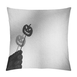 Personality  Halloween Decoration. Black Paper Halloween Pumpkin On A Stick In Hand Against A White Wall Background. Pillow Covers