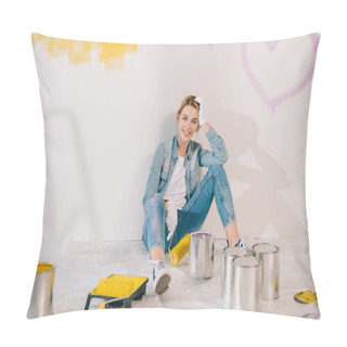Personality  Attractive Young Woman Holding Yellow Paint Roller While Sitting On Floor Near Wall Pillow Covers