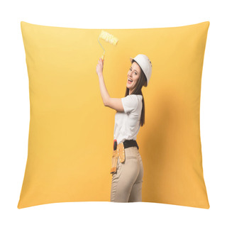 Personality  Smiling Handywoman Holding Paint Roller On Yellow Background With Copy Space Pillow Covers