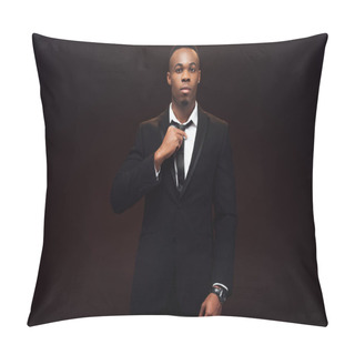 Personality  Handsome African American Man In Suit Adjusting Tie And Looking At Camera Isolated On Black  Pillow Covers
