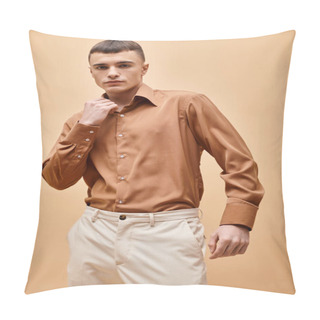 Personality  Portrait Of Stylish Handsome Man In Beige Shirt Touching Collar On Peachy Beige Background Pillow Covers