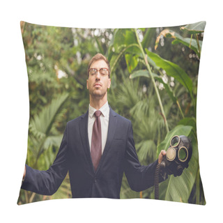 Personality  Handsome Businessman In Suit And Glasses With Closed Eyes Holding Rubber Gas Mask In Orangery Pillow Covers