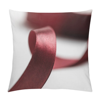Personality  Selective Focus Of Shiny Silk Curved Burgundy Ribbon On Grey Background Pillow Covers