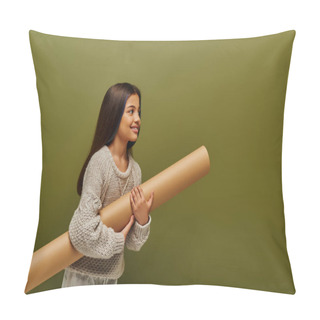 Personality  Smiling Brunette Preadolescent Girl In Trendy Knitted Sweater And Outfit Holding Rolled Paper And Looking Away Isolated On Green, Stylish Girl In Cozy Fall Attire Concept Pillow Covers