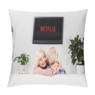 Personality  Senior Couple Embracing On Couch In Front Of Tv With Netflix Logo On Screen Pillow Covers