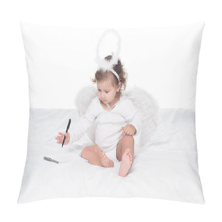 Personality  Little Angel With Wings And Nimbus Writing In Notepad On Bed, Isolated On White Pillow Covers