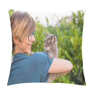 Personality  Playful Domestic Cat Held And Cuddled By Smiling Woman With Eyeglasses. Outdoor Setting In Green Home Garden. Shallow Depth Of Field, Focused On Animal Head. Toned Image. Pillow Covers