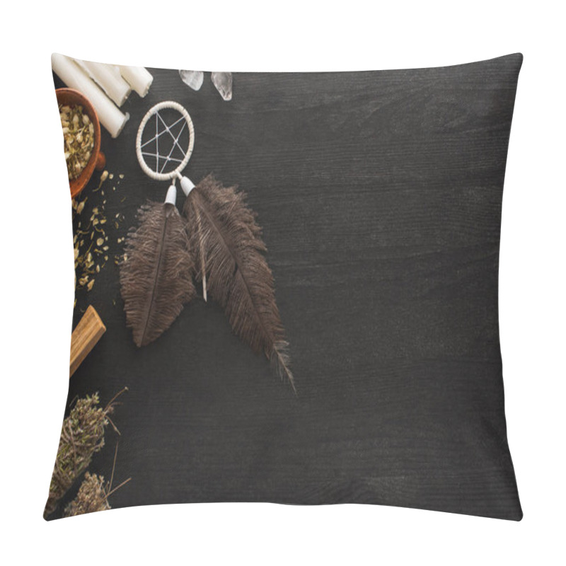 Personality  Top view of dreamcatcher, smudge sticks with magical crystals and candles on dark wooden surface pillow covers