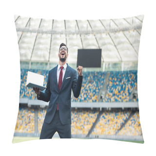 Personality  Low Angle View Of Happy Young Businessman In Suit Showing Yes Gesture And Holding Laptop With Blank Screen At Stadium Pillow Covers