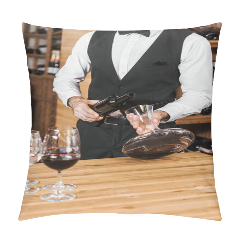 Personality  cropped shot of wine steward pouring wine from decanter at wine store pillow covers
