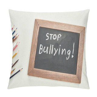 Personality  Top View Of Chalkboard In Wooden Frame With Stop Bullying Lettering Near Colored Pencils On Grey Background Pillow Covers
