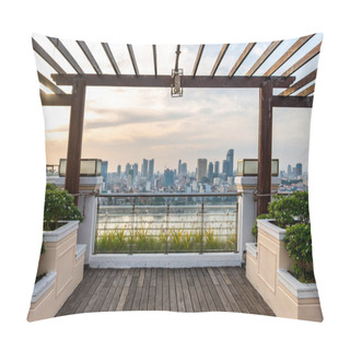 Personality  Phnom Penh,Cambodia-December 24th 2022:Framed By Wooden Beams Of A High Balcony,with Decorative Plants And Wooden Decking,the Setting Sun Hangs Above The City Skyline,across The Tonle Sap River. Pillow Covers