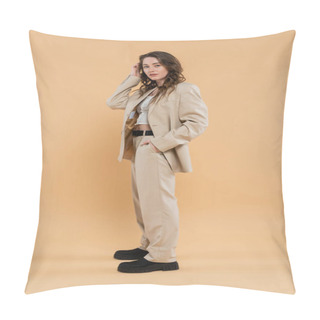 Personality  Style And Fashion Concept, Young Woman With Wavy Hair Standing In Fashionable Suit And Looking At Camera While Posing On Beige Background, Hand In Pocket, Modern Elegance Pillow Covers