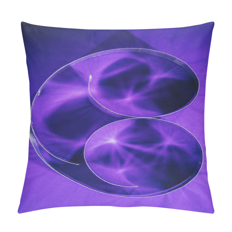 Personality  elevated view of paper spirals on purple pillow covers