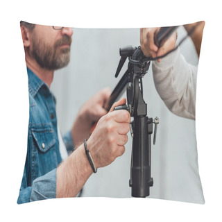 Personality  Cropped View Of Man Holding Light Stand With Assistant In Photo Studio  Pillow Covers