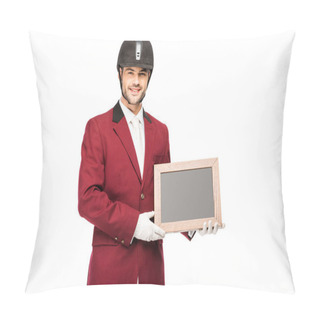 Personality  Happy Young Horseman In Uniform Holding Blank Chalkboard And Looking At Camera Isolated On White Pillow Covers
