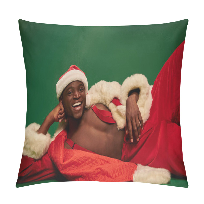 Personality  African American Man With Radiant Smile Lying Down In Santa Costume On Shirtless Body On Green Pillow Covers