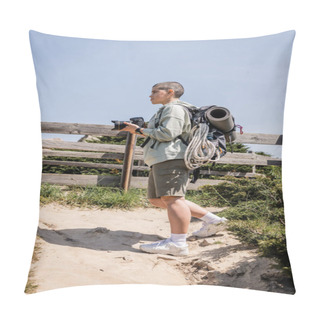 Personality  Side View Of Young Short Haired Female Hiker With Backpack And Travel Equipment Holding Digital Camera And Standing On Hill With Sky At Background, Hiker Finding Inspiration In Nature Pillow Covers