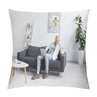 Personality  Man With Grey Hair Using Laptop While Sitting On Couch Near Cup Of Coffee And Smartphone With Blank Screen On Coffee Table Pillow Covers