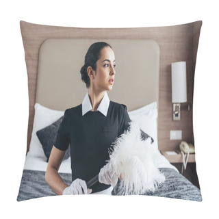 Personality  Pensive Brunette Maid In Apron And Gloves Holding Duster And Looking Away In Hotel Room Pillow Covers