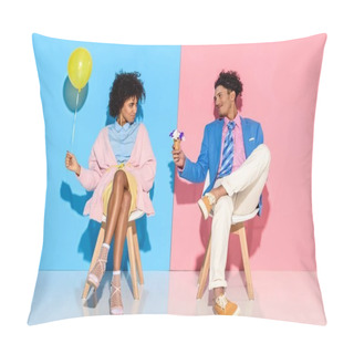 Personality  African American Man Presenting Flowers In Ice Cream Cone To Girlfriend While Sitting On Chairs Against Pink And Blue Wall Backdrop Pillow Covers