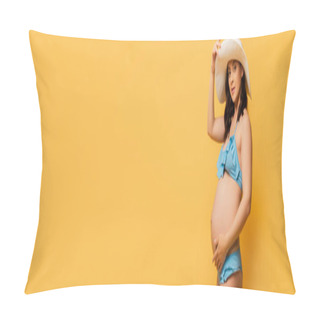 Personality  Horizontal Image In Swimsuit Touching Belly And Straw Hat While Posing On Yellow Pillow Covers