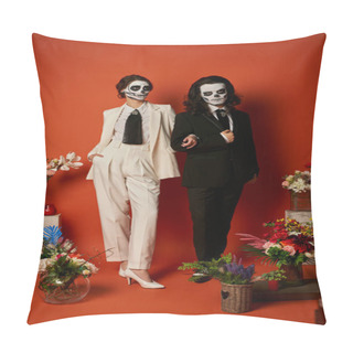 Personality  Couple In Catrina Makeup And Suits Posing Near Dia De Los Muertos Ofrenda With Flowers On Red Pillow Covers