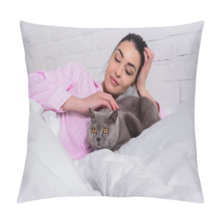 Personality  Portrait Of Smiling Woman In Pajamas Petting Britain Shorthair Cat While Resting On Bed At Home Pillow Covers