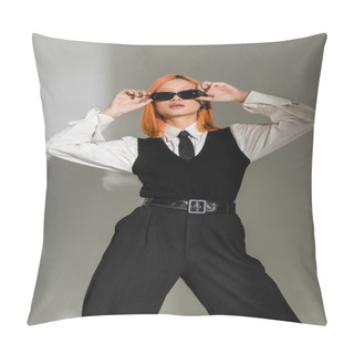 Personality  Fashion Shoot Of Expressive Asian Woman With Dyed Red Hair Adjusting Dark Sunglasses While Standing In White Shirt, Black Tie, Vest And Pants On Grey Shaded Background, Business Casual Style Pillow Covers