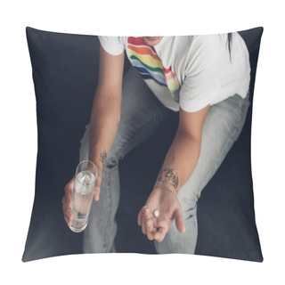 Personality  Cropped Shot Of Young Transgender Woman With Pill And Glass Of Water Sitting On Couch Pillow Covers