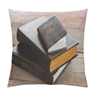 Personality  Close-up Shot Of Stacked Holy Bibles With New Testament Book On Wooden Surface Pillow Covers