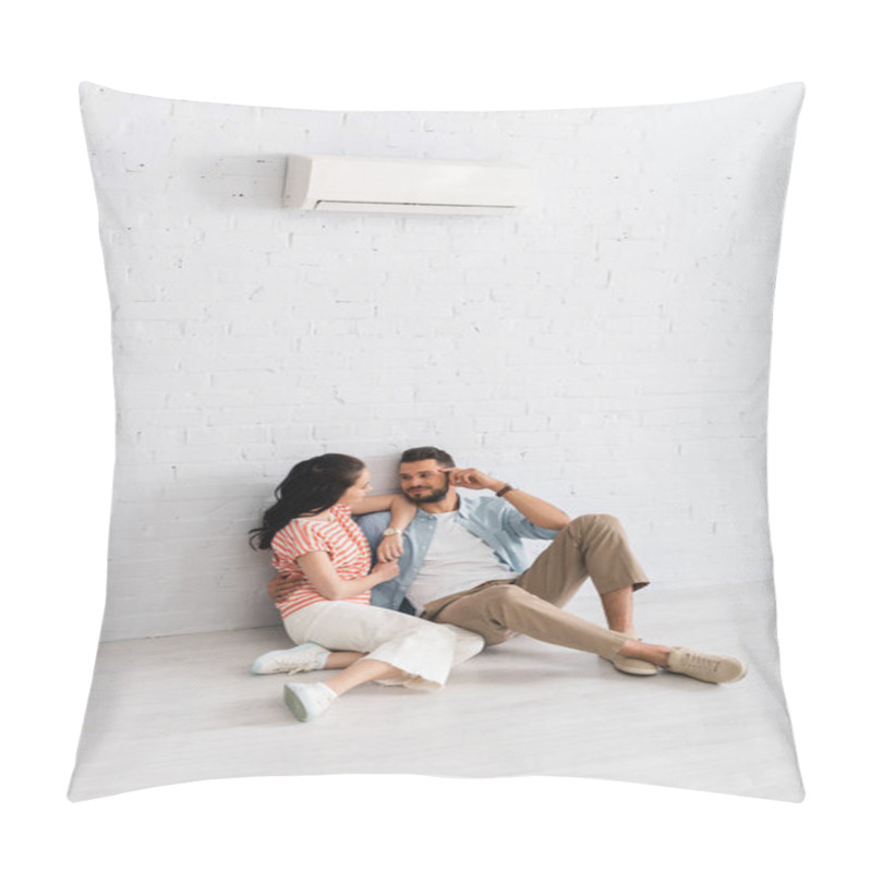 Personality  Handsome man hugging girlfriend while sitting together on floor under air conditioner  pillow covers