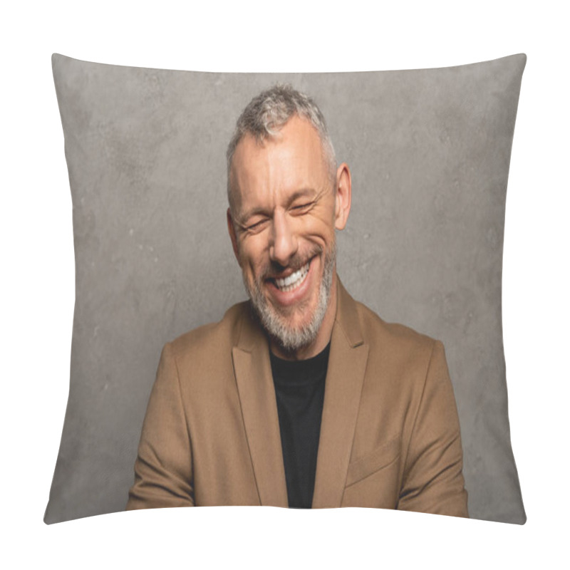 Personality  cheerful man with closed eyes laughing on grey  pillow covers