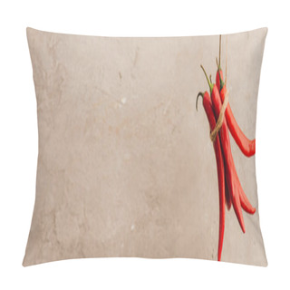 Personality  Bunch Of Red Chili Peppers Tied With Rope Hanging On Beige Concrete Background, Panoramic Shot Pillow Covers