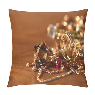 Personality  Closeup Of Pile Of Gold Jewelry On Wooden Surface With Lighting Effect Pillow Covers