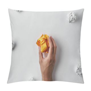 Personality  Cropped Shot Of Man Holding Crumpled Yellow Paper Surrounded With White Crumpled Papers On White Surface Pillow Covers