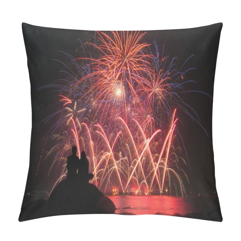 Personality  Silhouettes of couple sitting on rock. Watch the beautiful fireworks celebration at night. pillow covers
