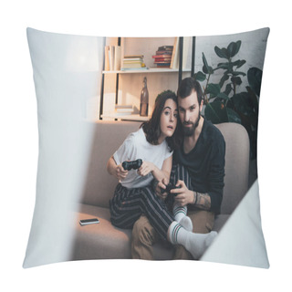 Personality  Beautiful Young Couple Sitting On Couch With Joysticks And Playing Video Game In Living Room With Copy Space Pillow Covers