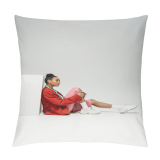 Personality  Thoughtful African American Woman In Modern And Vibrant Clothes Sitting Near Cube On Grey Backdrop Pillow Covers