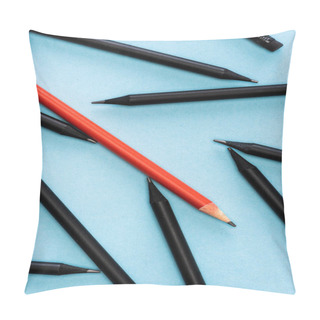 Personality  Top View Of Unique Red Pencil Among Black On Blue Background Pillow Covers