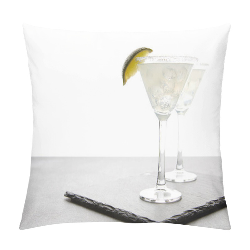 Personality  close up view of alcohol cocktails with lime on grey surface on white pillow covers