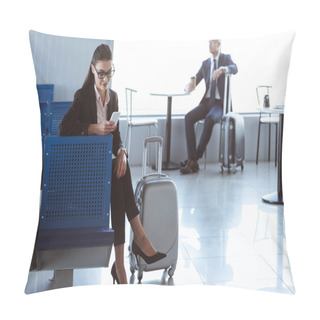 Personality  Young Businesswoman Using Smartphone While Businessman Sitting With Coffee To Go In Airport Pillow Covers