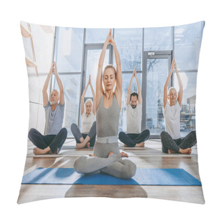 Personality  Group Of Senior People Practicing Yoga With Instructor In Lotus Pose On Mats In Studio Pillow Covers