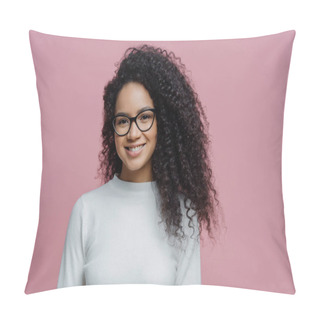 Personality  Headshot Of Lovely Curly Haired Woman With Healthy Skin And Toothy Smile, Dressed In White Jumper, Wears Transparent Glasses, Isolated Over Rosy Background. People, Face Expressions And Emotions Pillow Covers