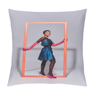 Personality  Joyful African American Model In Evening Dress, Pink Gloves And Heels With Feathers Looking At Camera Near Frame On Grey Background, Modern Generation Z Fashion Concept Pillow Covers