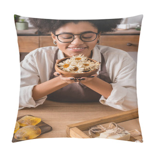 Personality  Happy African American Craftswoman In Eyeglasses Holding Wooden Bowl With Dried Camomiles Near Bars Of Handmade Soap Pillow Covers