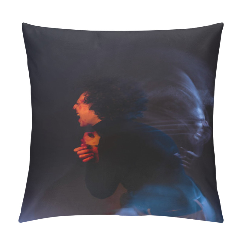Personality  double exposure of wounded and angry african american man shouting on black background with red and blue light pillow covers